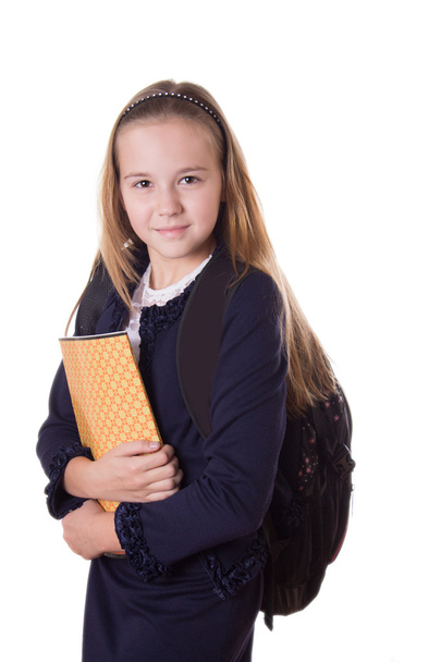 Улыбающаяся школьница в форме и с сумкой
 - Фото, изображение