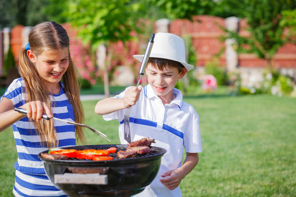 Kids having a barbecue party - Zdjęcie, obraz
