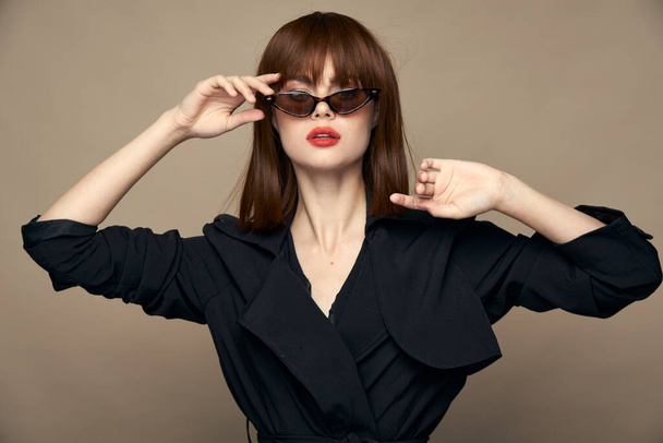Charming brunette Correct the glasses on the face elegant appearance - Фото, зображення