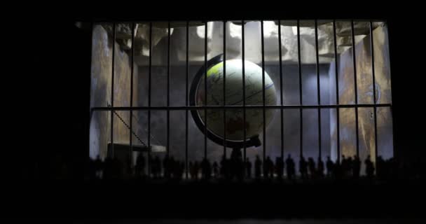 コロナウイルスは創造的な概念をロックダウンする。古い刑務所の中に閉じ込められた惑星地球。創造的なアートワーク装飾。選択的焦点 - 映像、動画