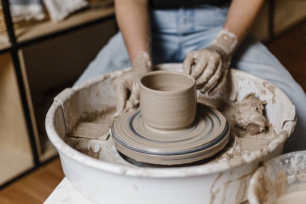 Female hands make dishes from clay - Photo, Image
