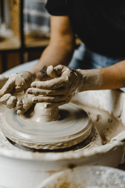 Female hands sculpt clay dishes - Photo, Image
