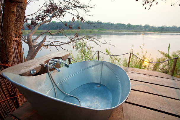 Luxury bathroom in riverbank outdoor, Africa - Photo, Image