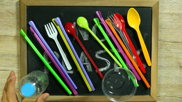 Moving  plastic  straw  by hand   and  reveal    no plastic word on board - Video