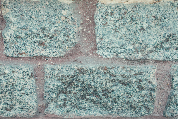 灰色で研磨されていない花崗岩で作られた石垣  - 写真・画像