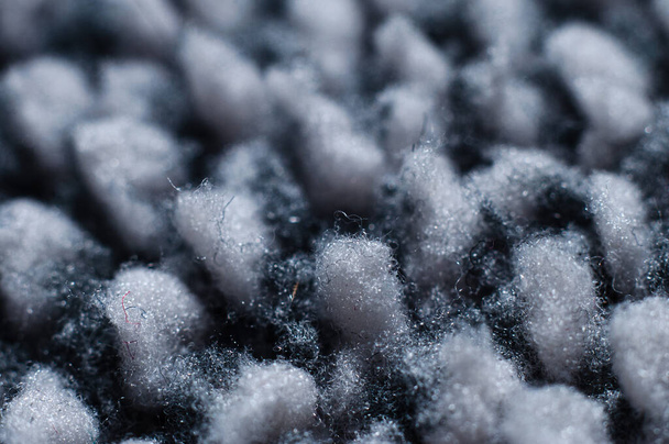 Tissu chaud à base de tissu polaire gris gros plan, macro photographie - Photo, image
