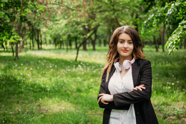 Work life balance, Essentials of Wellbeing, harmony between work and personal life. Young business women in formal suit enjoying the nature in public park - Photo, Image