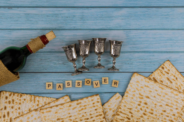 Matzoh jewish holiday red kosher glasses wine with a of matzah a Passover Haggadah - Photo, Image
