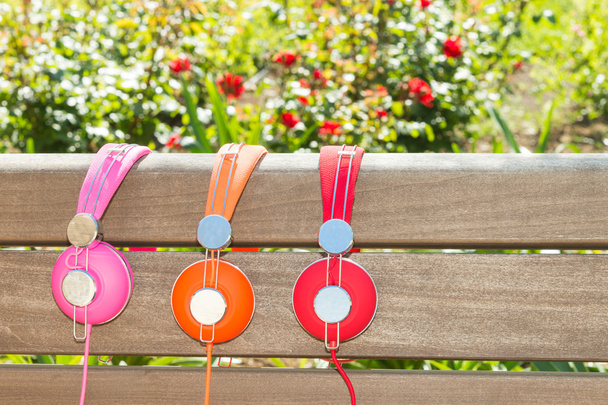 Three varicolored headphones of different colors - Photo, Image