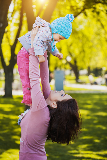 Beautiful Mother And Baby outdoors - 写真・画像