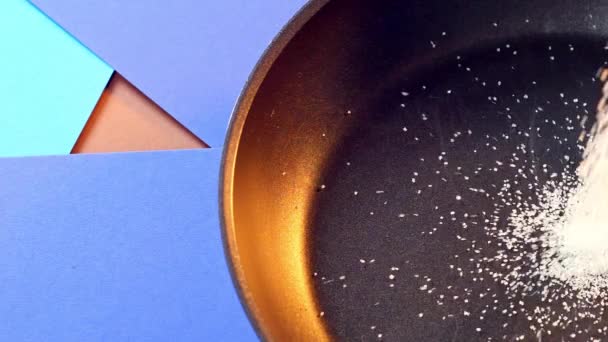 Close up on sugar dropping on the pan. Process of cooking caramel for sweets. - Footage, Video