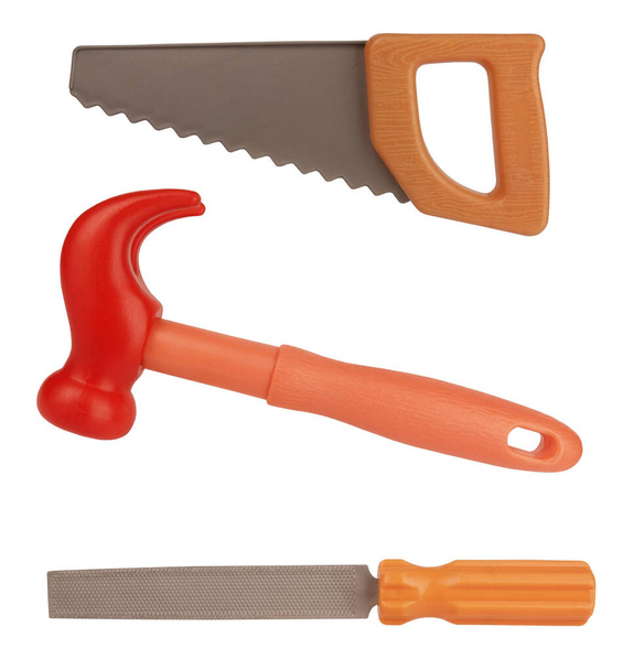 Herramientas de juguetes de plástico sierra de martillo y archivo aislado sobre fondo blanco                                - Foto, Imagen