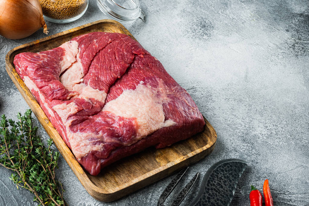 Raw Beef belly, beef brisket meat set,with ingredients for smoking  making  barbecue, pastrami, cure, on gray stone background,  with copy space for text - Photo, Image