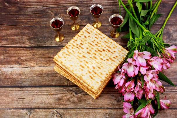 Four cups full of wine with matzah. Jewish holidays Passover concept. - Photo, Image