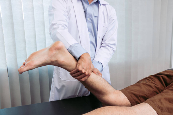 Physical therapists use their hands to check the calf muscles. - Photo, Image