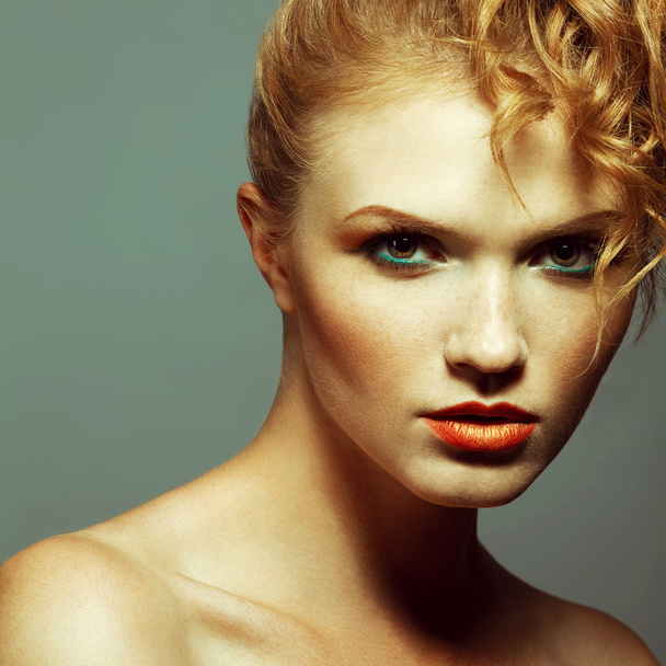 Emotive portrait of a fashionable model with red (ginger) curly  - Photo, image
