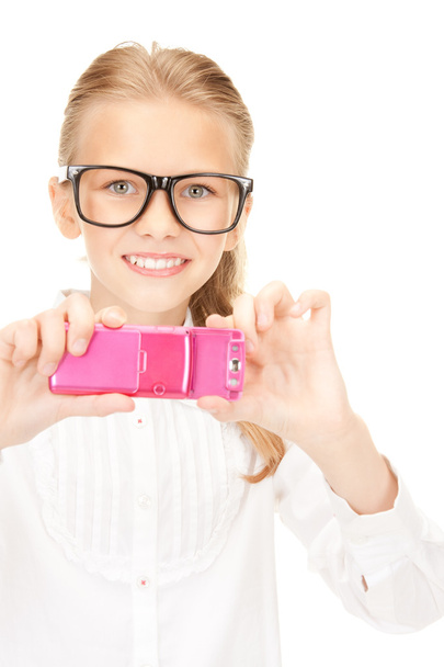 Happy girl taking picture with cell phone - Фото, зображення