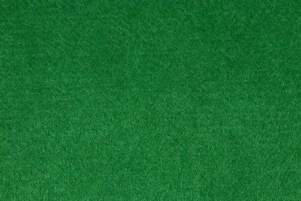 Vista de cerca de fieltro verde para fondo o telón de fondo - Foto, Imagen