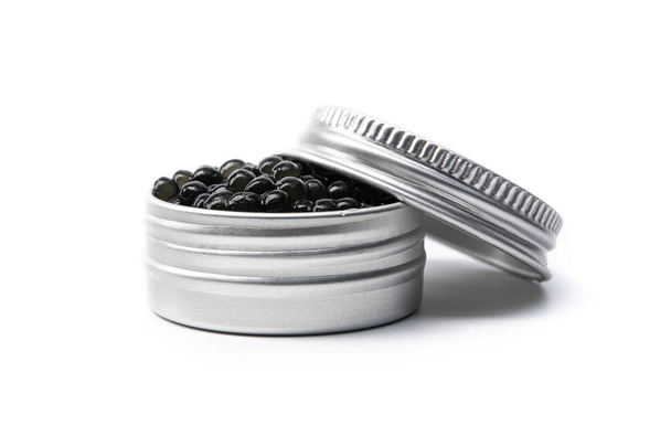 Black caviar in metal container isolated on white background - Photo, Image