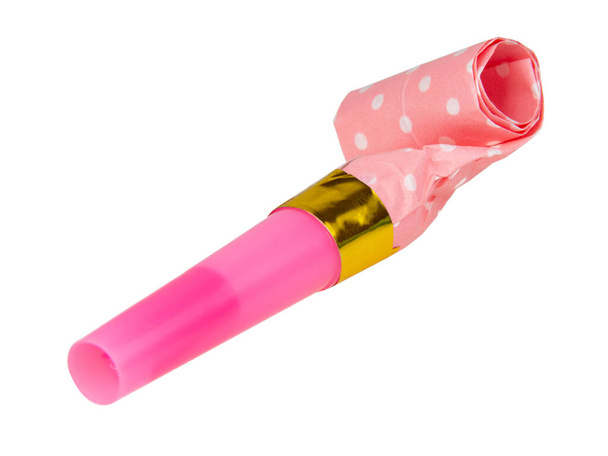 Rolled pink festive noisemaker or party whistle horn isolated on the white background - Photo, Image