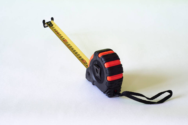Working tape measure on a light background. - Photo, Image