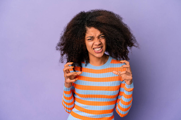 Young african american curly woman isolated on purple background upset screaming with tense hands. - Photo, Image