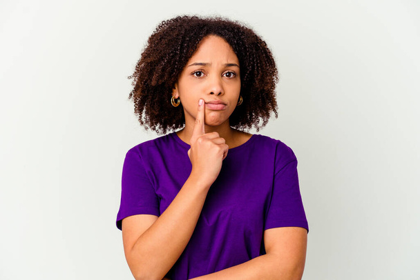 Young african american mixed race woman isolated looking sideways with doubtful and skeptical expression. - Photo, Image