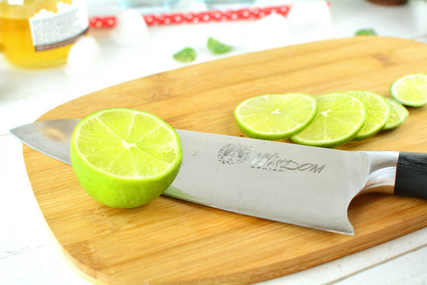 fresh sliced lime on wooden board - Fotoğraf, Görsel