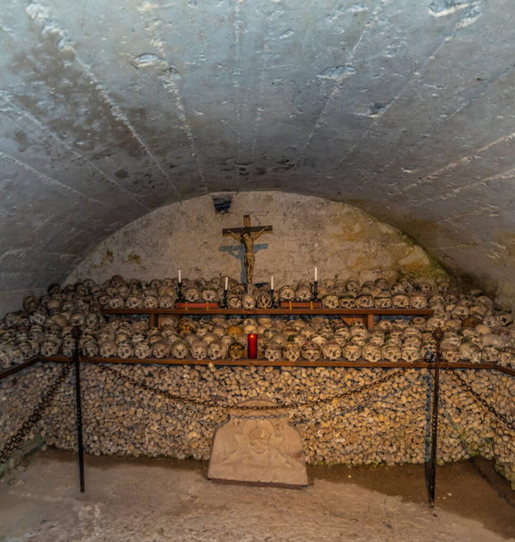 Ossuary house interior with bones and skulls in Hallstatt town in central Austria - Photo, Image