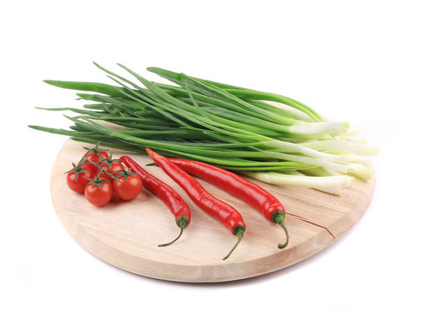 Vegetables on wooden platter. - Photo, Image