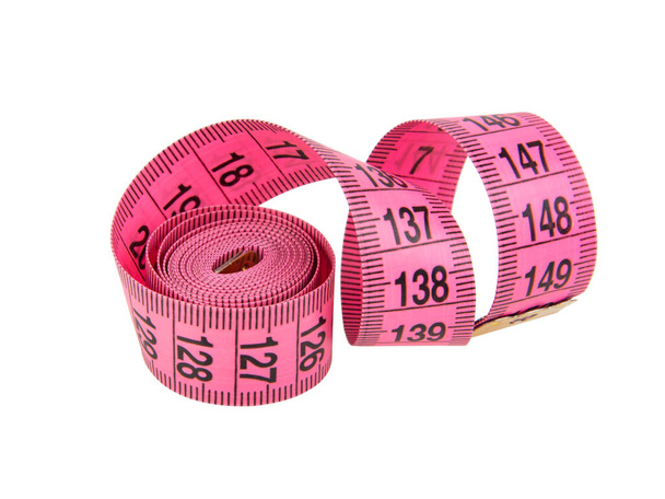 Pink tape measure roll isolated on the white background - Photo, Image