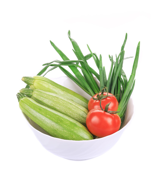 Bowl with marrows and tomatoes. - Photo, Image