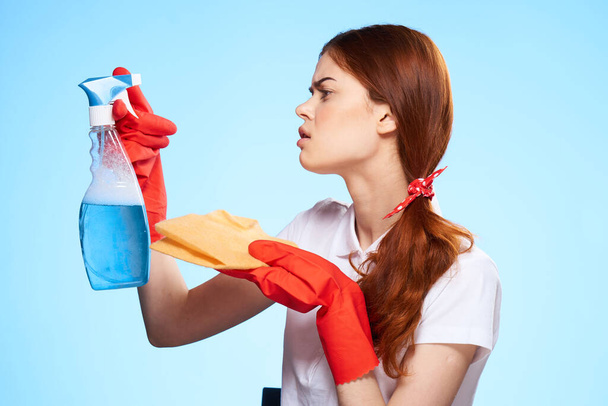professional cleaning lady cleaning supplies home service blue background - Photo, Image