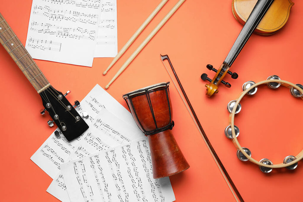 Different musical instruments and music notes on color background - 写真・画像