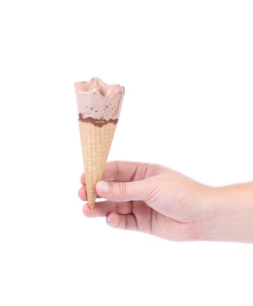 Hand holds ice cream cone. - Zdjęcie, obraz
