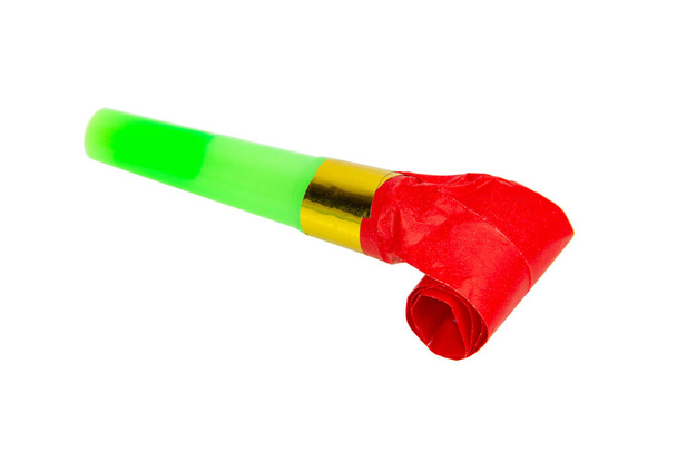 Rolled bright festive noisemaker or party whistle horn isolated on the white background - Photo, Image