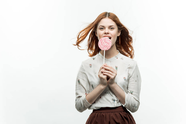 pretty woman holding lollipop near face emotions luxury enjoyment - Photo, Image