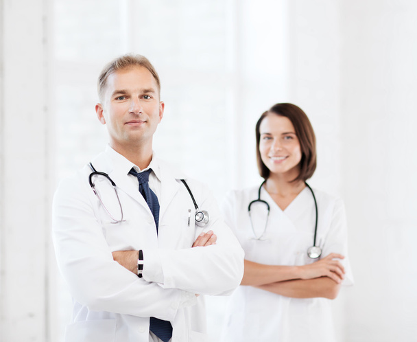Two doctors with stethoscopes - Фото, зображення
