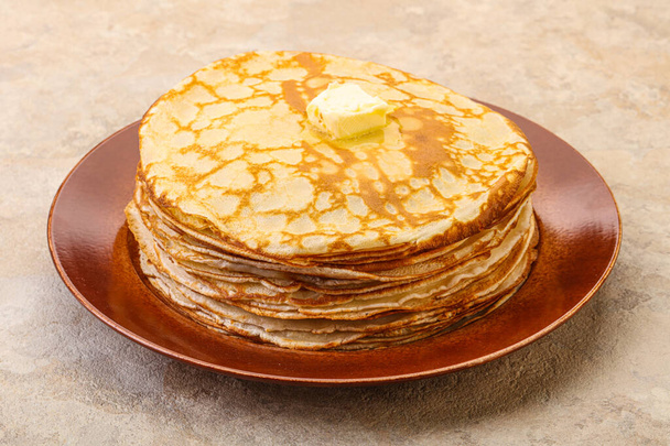 Stack of Russian traditonal pancakes with butter - Photo, Image