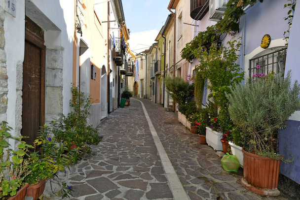 A narrow street between the old houses of Baselice, an old town in the province of Benevento, Italy. - Photo, Image