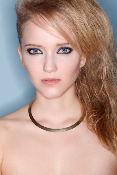 Portrait of young beautiful blond woman with smokey eyes - Fotoğraf, Görsel