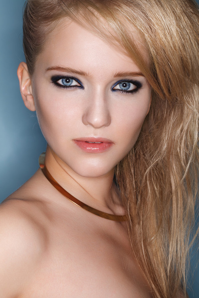 Portrait of young beautiful blond woman with smokey eyes - Photo, image