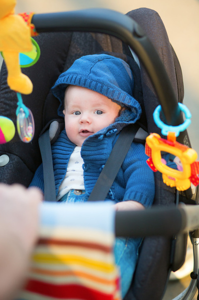 Little baby boy in a stroller - Fotó, kép