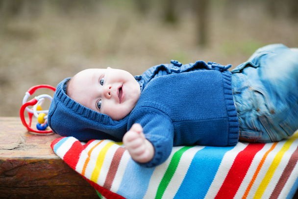 Adorable 4 month baby boy lying on his back - Foto, Imagen