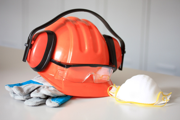 Orange hard hat, earphones, gloves, Face Mask and goggles - Photo, Image