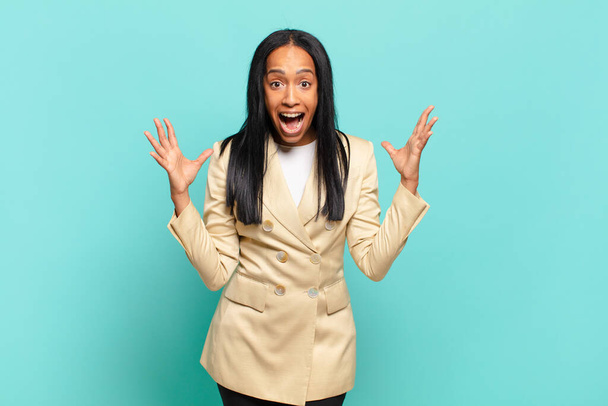 young black woman feeling happy, astonished, lucky and surprised, like saying omg seriously? Unbelievable. business concept - Фото, изображение