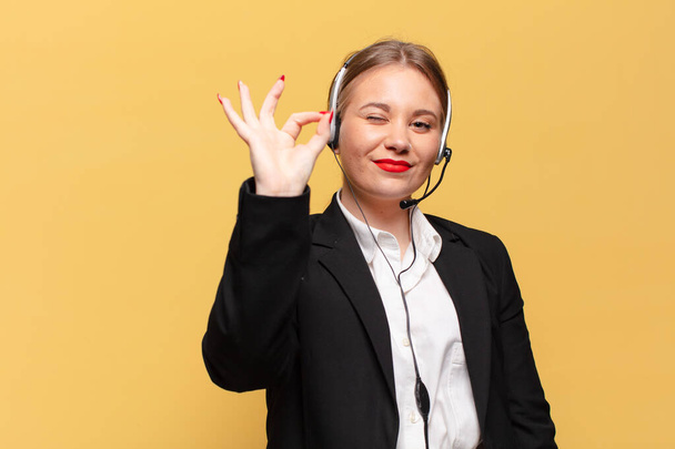 young pretty woman. happy and surprised expression. telemarketer concept - Фото, зображення