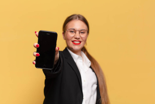 young pretty woman. happy and surprised expression. smart phone concept - Valokuva, kuva