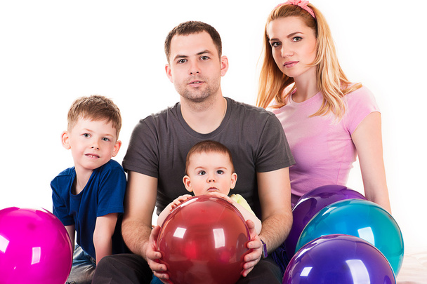 Caucasian family with balloons - Фото, изображение