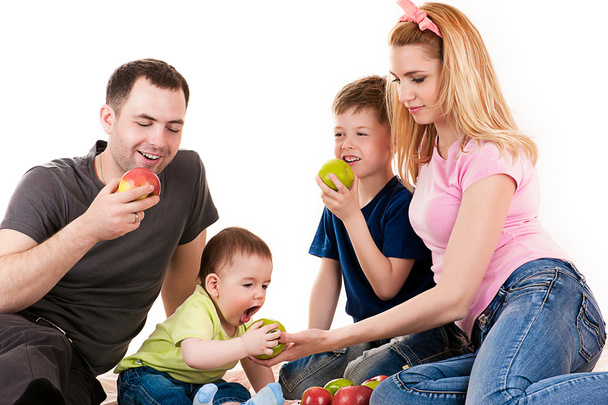 Caucasian family with children eating apples - Foto, Imagem